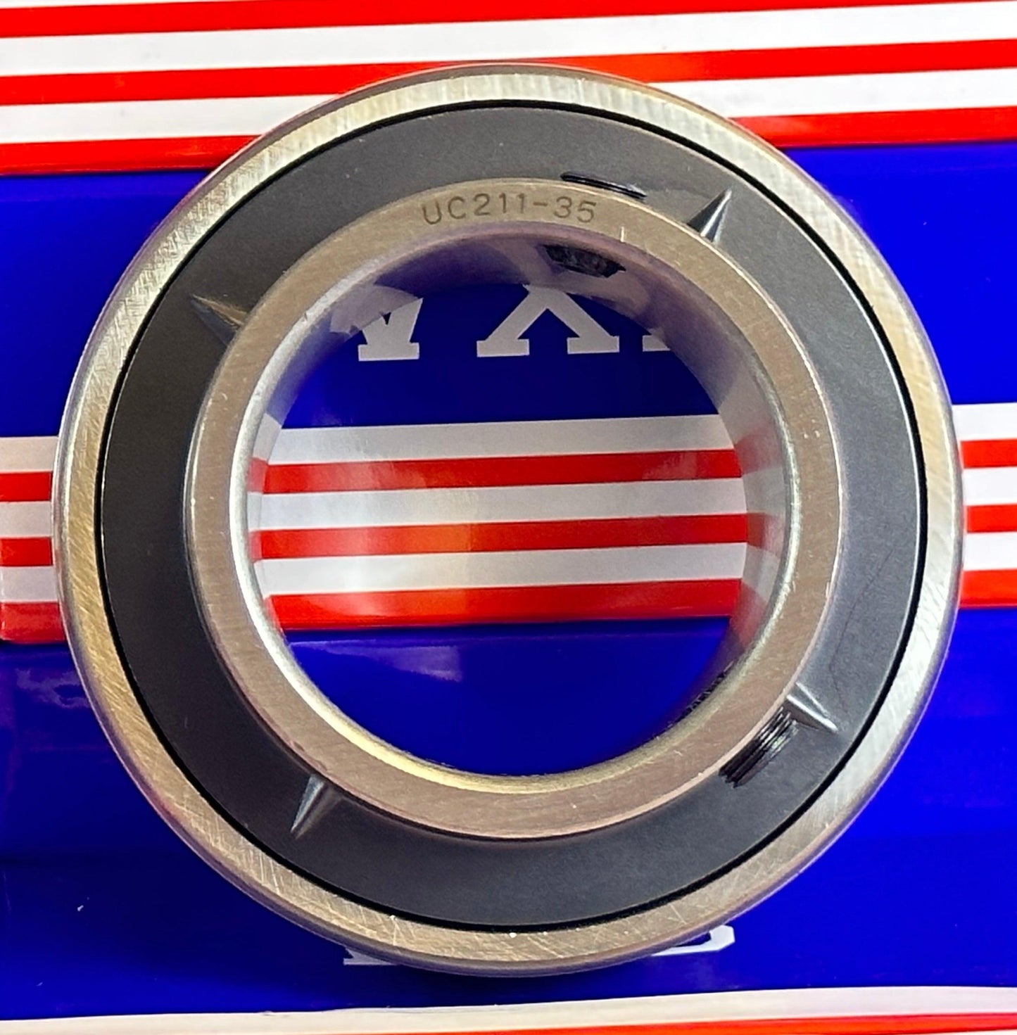 UC211-35 Bearing Insert 2 3/16 Inch Mounted